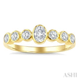 1/2 Ctw Bezel Set Oval and Round Cut Diamond Fashion Band in 14K Yellow Gold