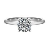 The dazzling solitaire diamond take center stage. The petite band adds to the sleek, classic look.