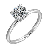 The dazzling solitaire diamond take center stage. The petite band adds to the sleek, classic look.