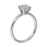 The dazzling solitaire diamond take center stage. The petite band adds to the sleek, classic look.
