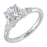Five times diamonds for five times sparkles. A classic, lustrous band completes the look of this five stone engagement ring.