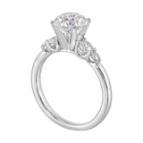 Five times diamonds for five times sparkles. A classic, lustrous band completes the look of this five stone engagement ring.