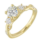 Round solitaire with smaller side diamonds atop a crisscross band with flowing diamond accents.