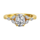 Elongated oval center framed by marquise diamond trios on each side and a pinched shank.