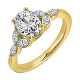 Elongated oval center framed by marquise diamond trios on each side and a pinched shank.