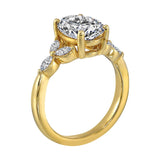 Elongated oval center framed by marquise diamond trios on each side and a pinched shank.