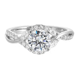 Nature-inspired three-stone ring with an intertwined design of pavé diamonds and polished metal.