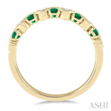 1.8 MM Emerald and 1/6 Ctw Round Cut Diamond Precious Waves Wedding Band in 14K Yellow Gold