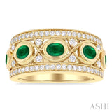 4x3 MM Oval and 2.8 MM Round Cut Emerald and 3/8 Ctw Curvy Criss-Cross Single Cut Diamond Precious Band in 14K Yellow Gold